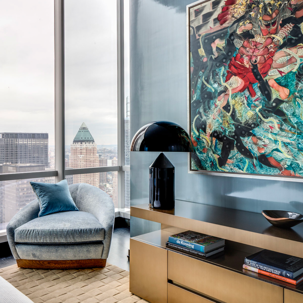 Well designed living room with abstract art above a brass console table.  This is part of a project in which full service designs were provided.