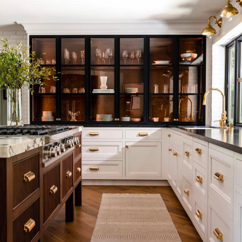 Remodeled kitchen increasing home value.  This luxury kitchen with white base cabinets and glass uppers are perfectly paired with subway wall tile. 