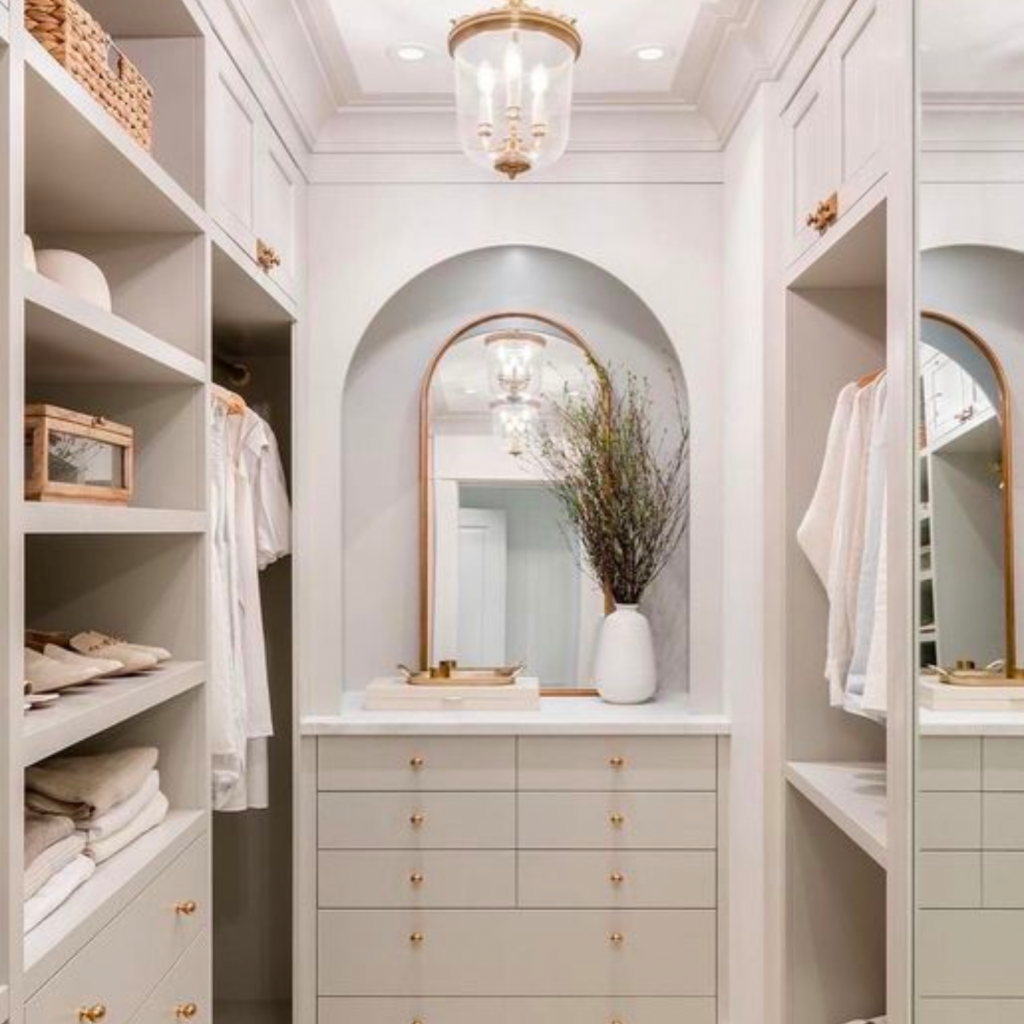 beautifully-designed-closet-with-organized-clothing-shoes-containing-plenty-of-storage-large mirror.  Clean and uncluttered environment promoting calm mental health.