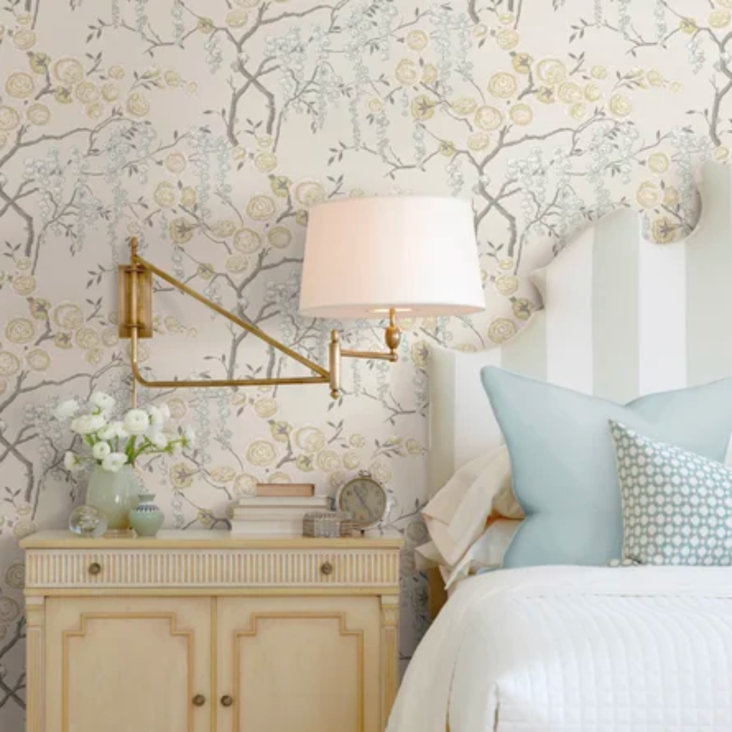 A bedroom with varying patterns and textures beautifully designed and paired.